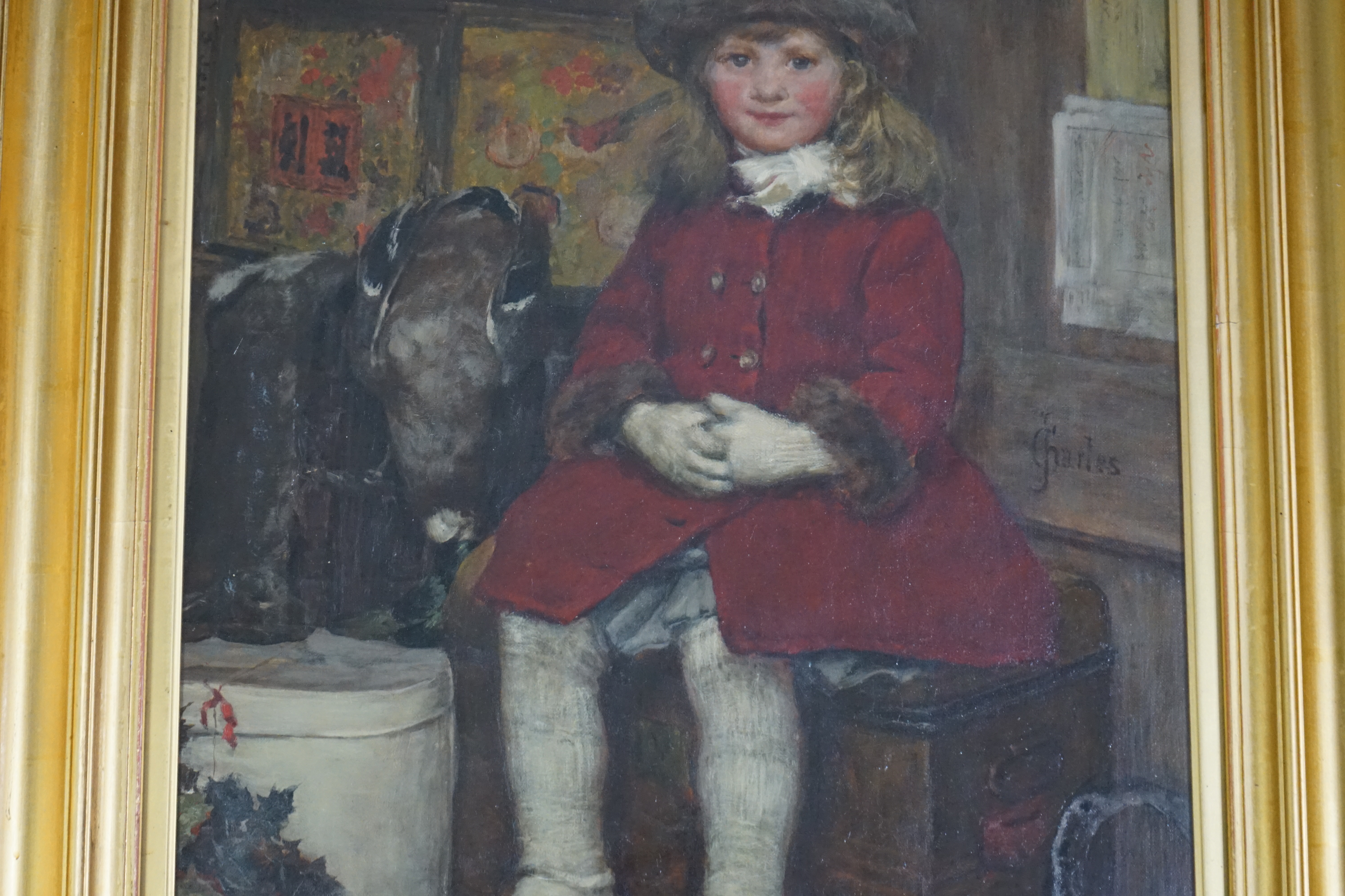 James Charles (British, 1851-1906), Seated child in a red coat, oil on canvas, 56 x 43cm